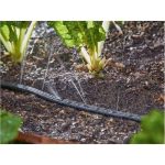 Tubo per irrigazione Parkside 20m Ø13mm in uso su orto, acqua che fuoriesce tra le piante